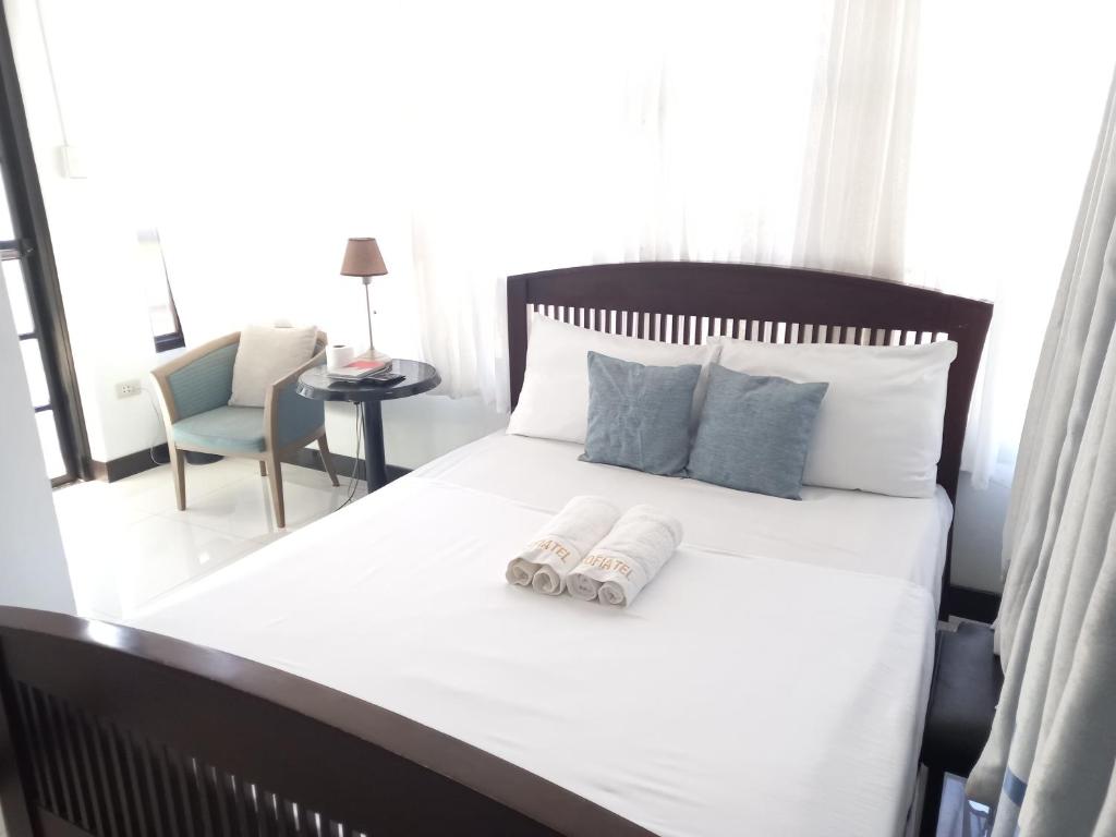Postel nebo postele na pokoji v ubytování SOFIATEL Rooms