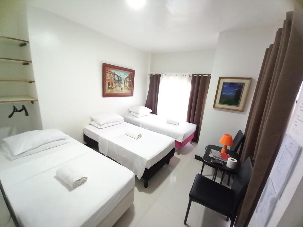 Postel nebo postele na pokoji v ubytování SOFIATEL Rooms