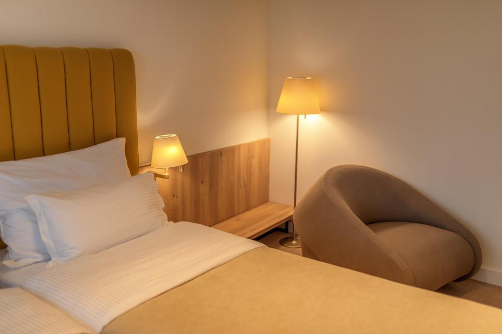 Cama o camas de una habitación en HOTEL AGAPE