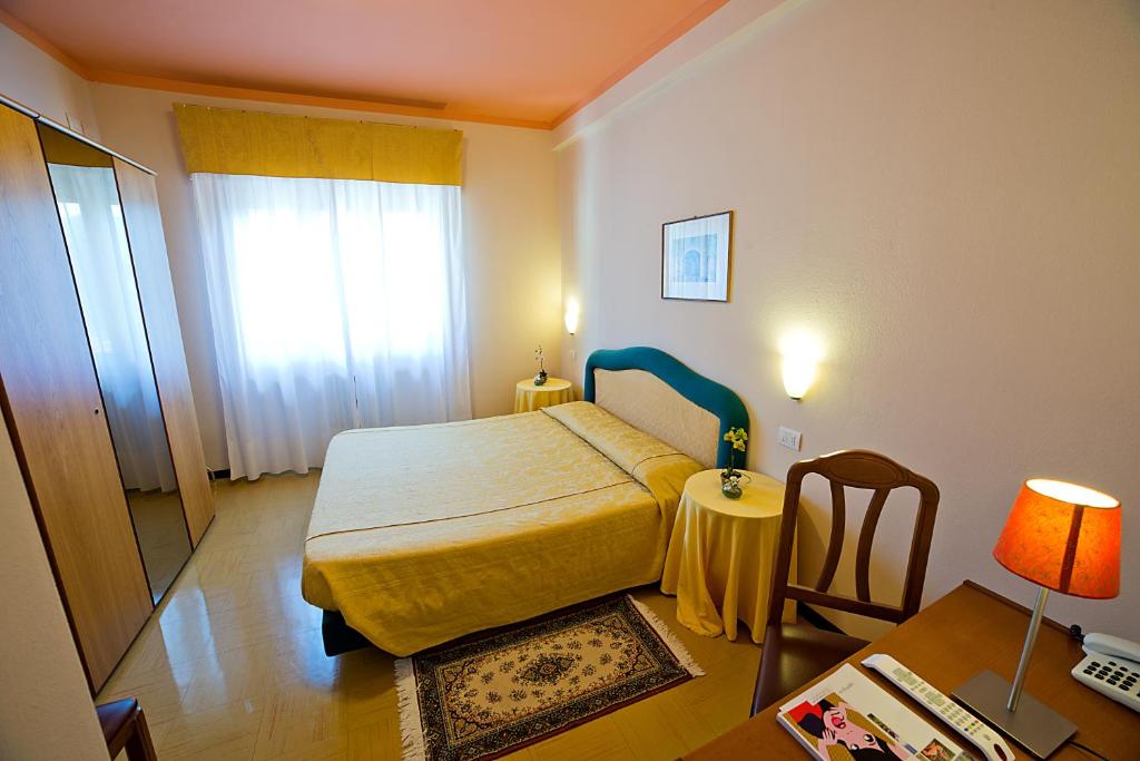 Postel nebo postele na pokoji v ubytování Hotel Europa