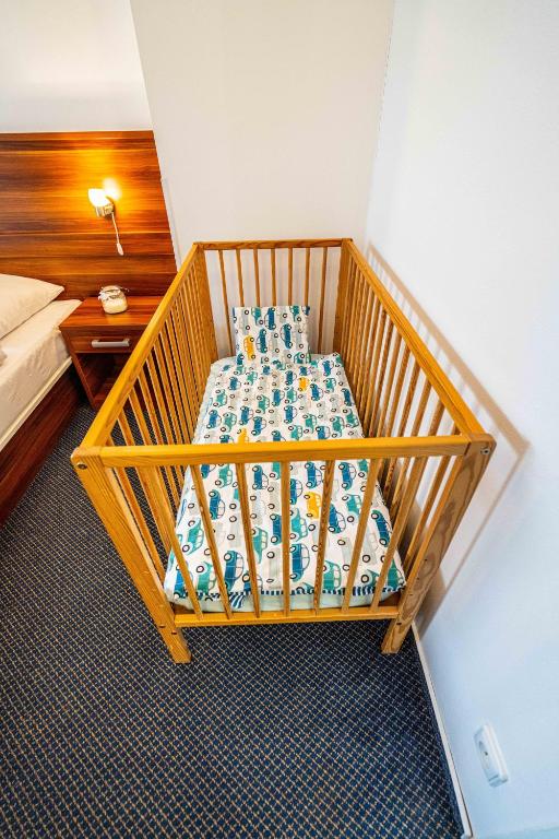 Posteľ alebo postele v izbe v ubytovaní WELLNESS HOTEL FRYMBURK APARTMAN 502C