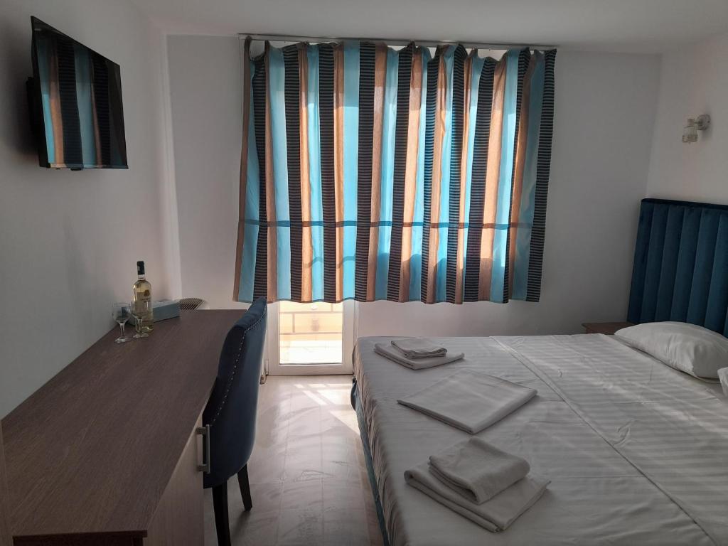 Postel nebo postele na pokoji v ubytování ADMAR Rooms & Restaurant