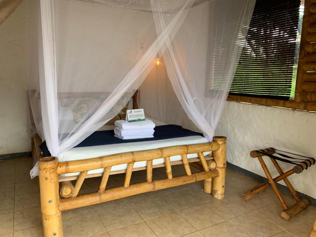 Posteľ alebo postele v izbe v ubytovaní Ecohotel Los Mikos