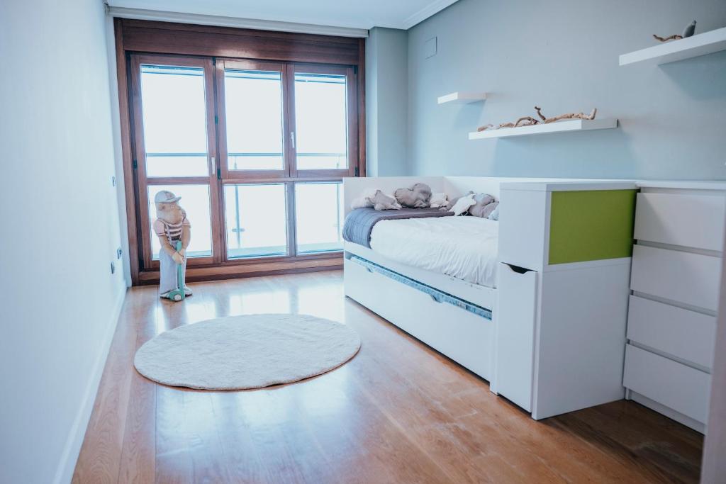 Postel nebo postele na pokoji v ubytování EL SEXTO DE LA PLAYA + PARKING GRATIS