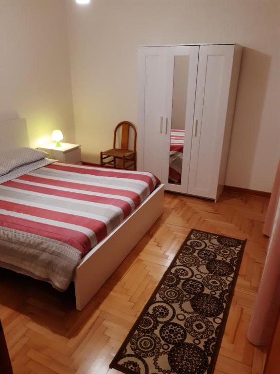 A bed or beds in a room at Miniappartamento Singolo