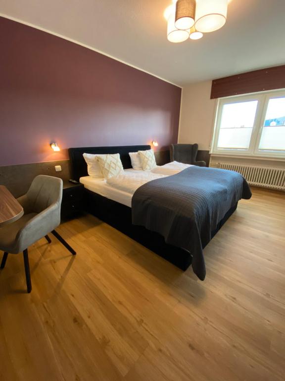 Postel nebo postele na pokoji v ubytování Hotel Schütz