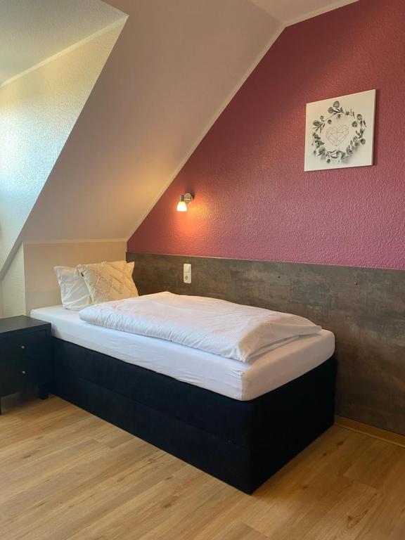 Postel nebo postele na pokoji v ubytování Hotel Schütz