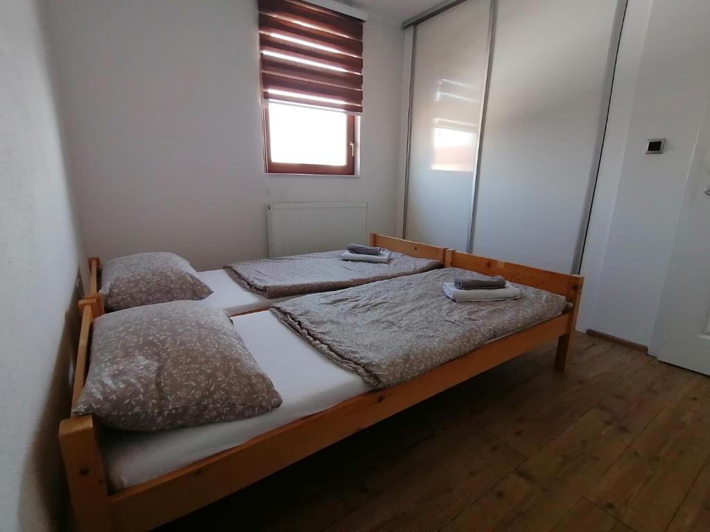 Postel nebo postele na pokoji v ubytování Rooms Delux Sarajevo