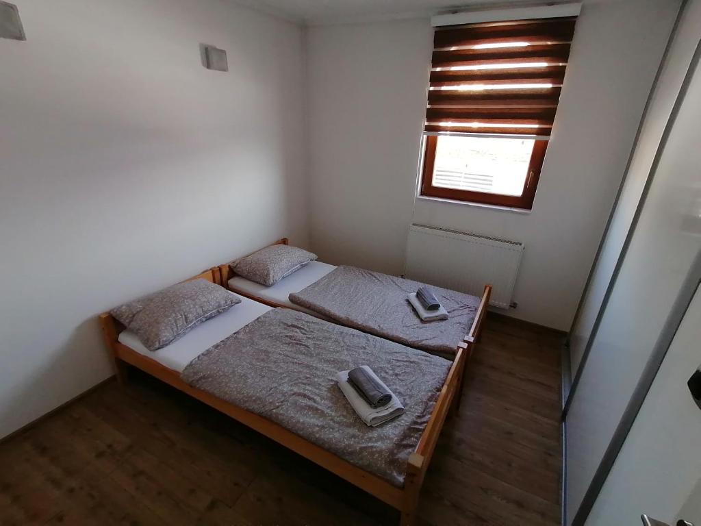Postel nebo postele na pokoji v ubytování Rooms Delux Sarajevo