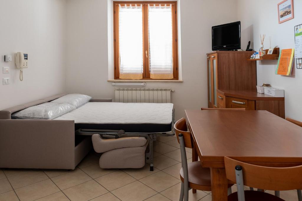 A bed or beds in a room at Casa in Chiana