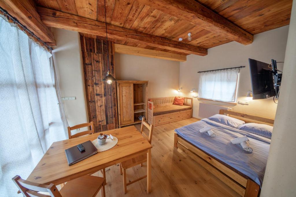 Postel nebo postele na pokoji v ubytování Apartment Ve Mlýně