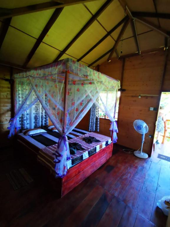 Postel nebo postele na pokoji v ubytování lake paradise cabana