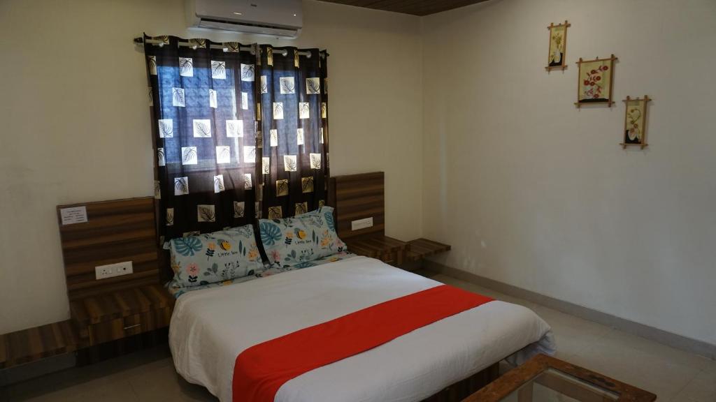Posteľ alebo postele v izbe v ubytovaní Happy Stay, Panchgani