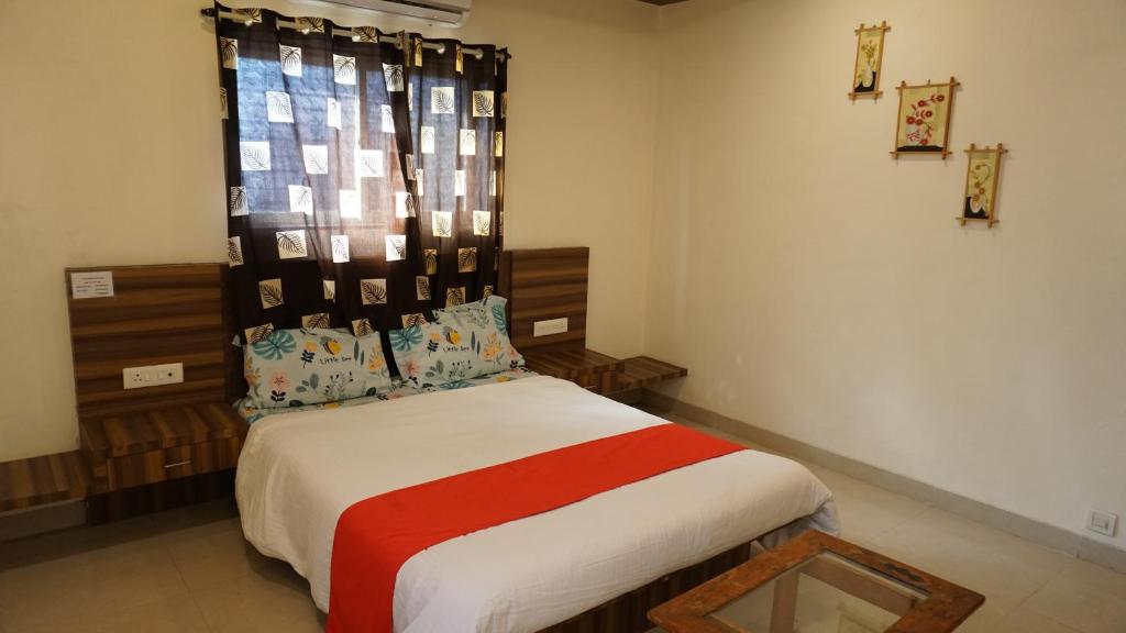 Posteľ alebo postele v izbe v ubytovaní Happy Stay, Panchgani
