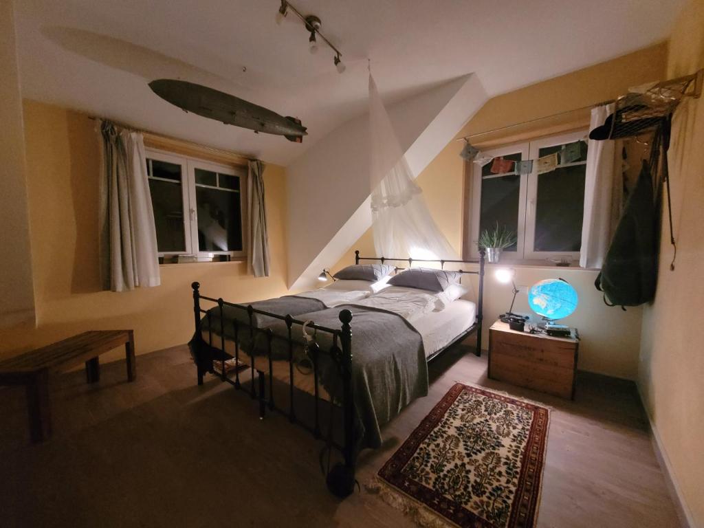Postel nebo postele na pokoji v ubytování In der alten Gärtnerei B&B