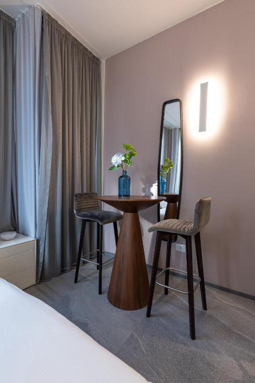 A bed or beds in a room at BePlace Apartments in Duomo