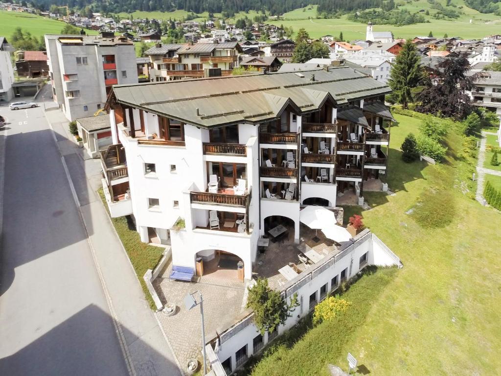 an aerial view of a building in a city at Arena Guesthouse in Flims