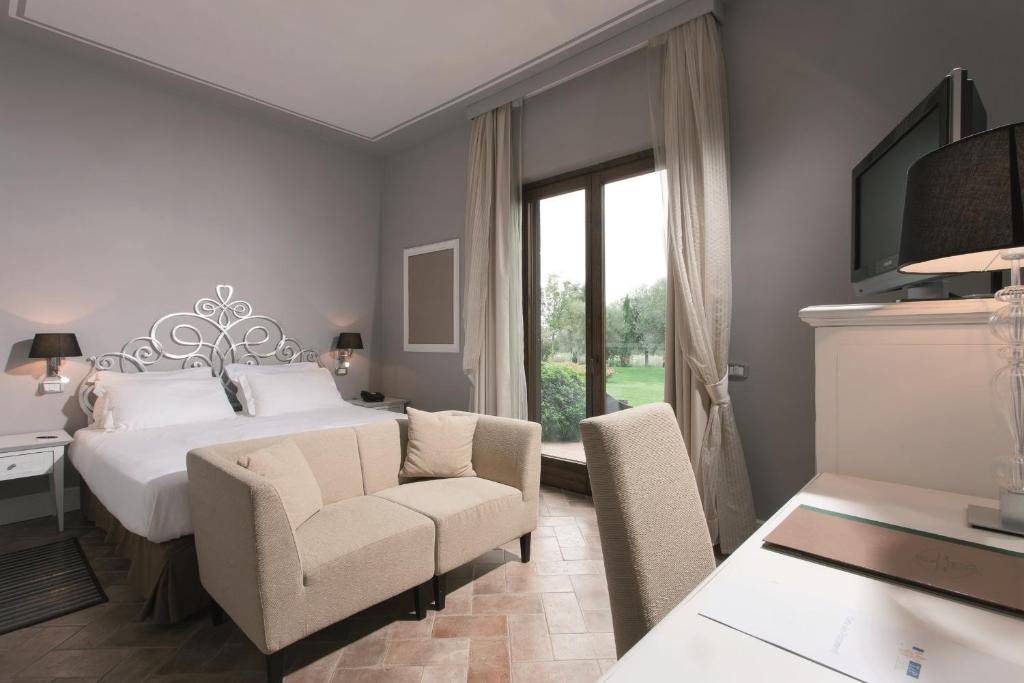 Postel nebo postele na pokoji v ubytování Alla Corte Delle Terme Resort