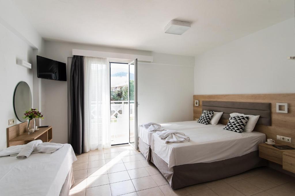 Postel nebo postele na pokoji v ubytování Vagelis Apartments Malia