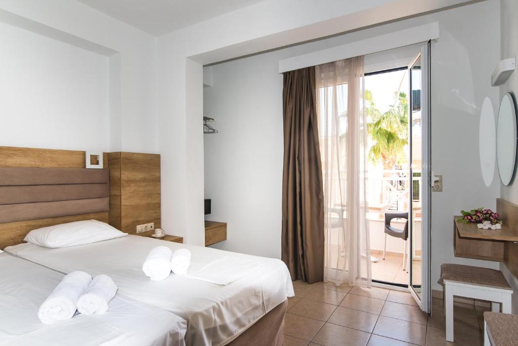 Postel nebo postele na pokoji v ubytování Vagelis Apartments Malia