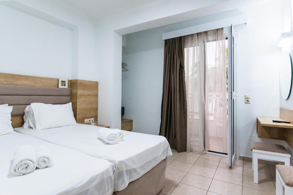 Postel nebo postele na pokoji v ubytování Vagelis Apartments Malia