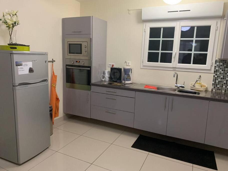 Kuchyň nebo kuchyňský kout v ubytování Superbe appartement à Trinité