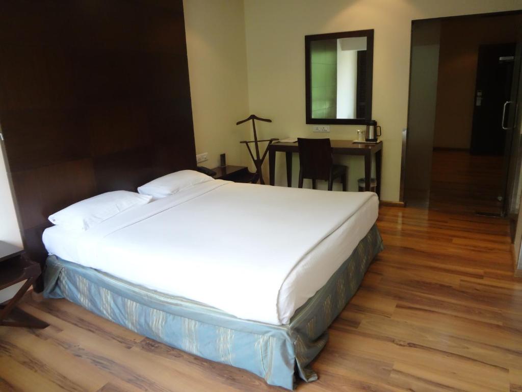 Postel nebo postele na pokoji v ubytování Shantai Hotel