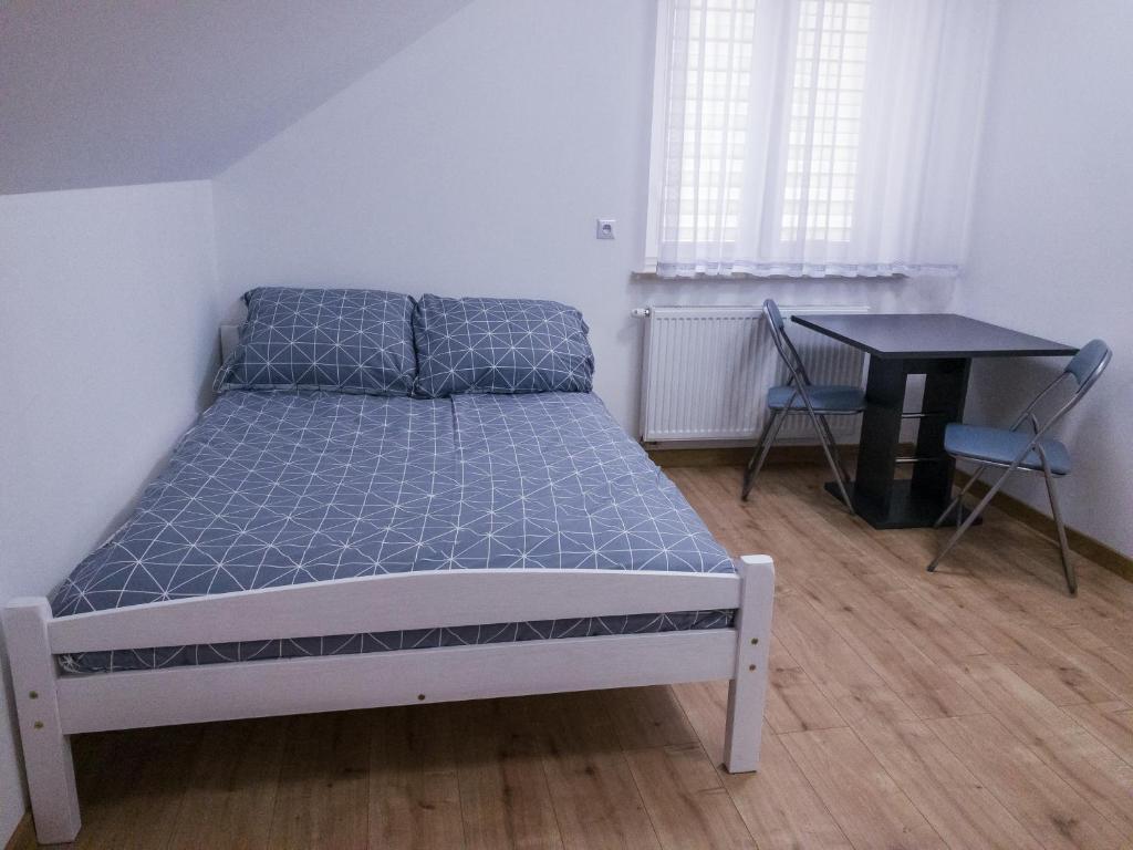 Posteľ alebo postele v izbe v ubytovaní Agroturystyka u Aleksa