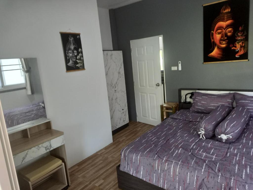 Postel nebo postele na pokoji v ubytování sweet home phangan
