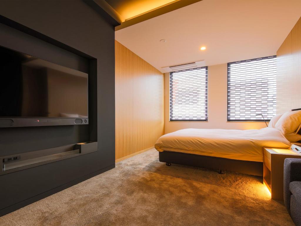 Letto o letti in una camera di Hotel Muso