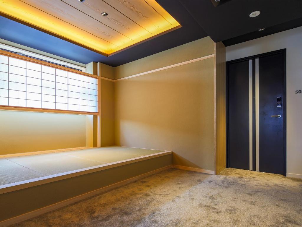 Letto o letti in una camera di Hotel Muso