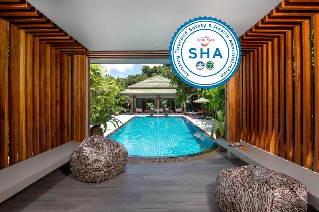 a pool at the sha resort and spa at Karon Beach Pool Villa - Sha Extra Plus in Karon Beach