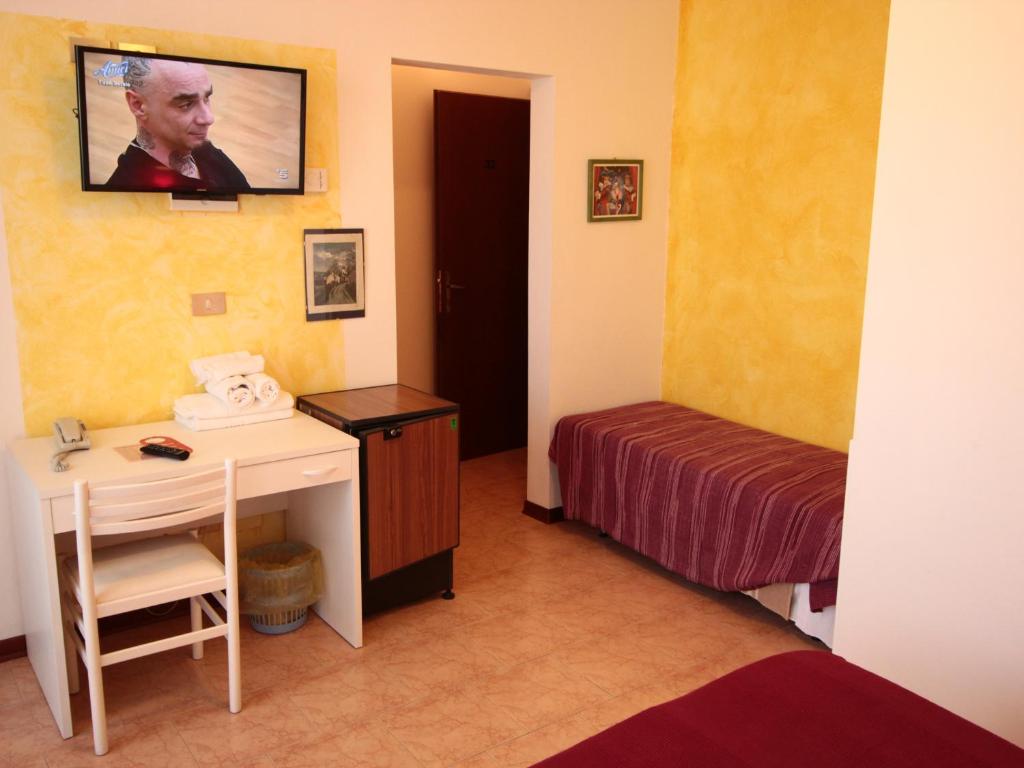 Postel nebo postele na pokoji v ubytování Hotel Nuova Graziosa
