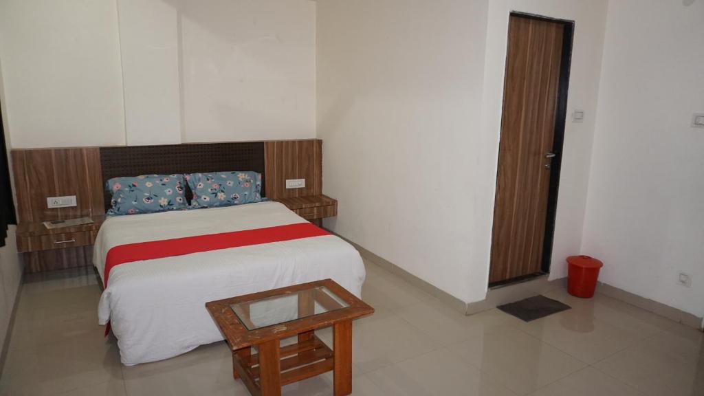 Posteľ alebo postele v izbe v ubytovaní Happy Stay, Panchgani