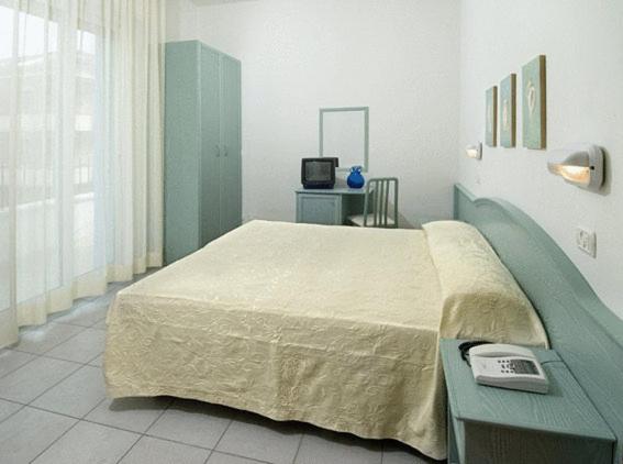Postel nebo postele na pokoji v ubytování Hotel Belmar