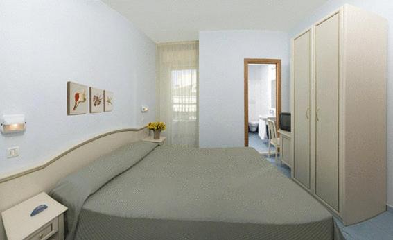 Postel nebo postele na pokoji v ubytování Hotel Belmar