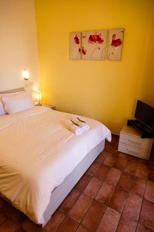 A bed or beds in a room at Poggio Verde