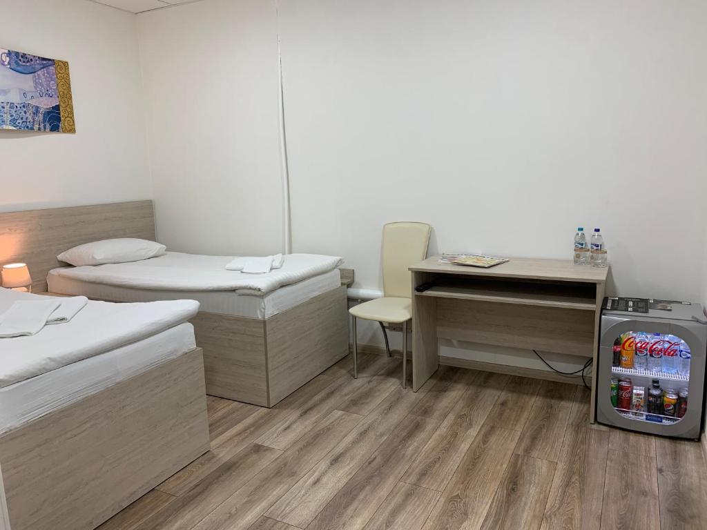 Postel nebo postele na pokoji v ubytování Міні-Готель Білий Квадрат