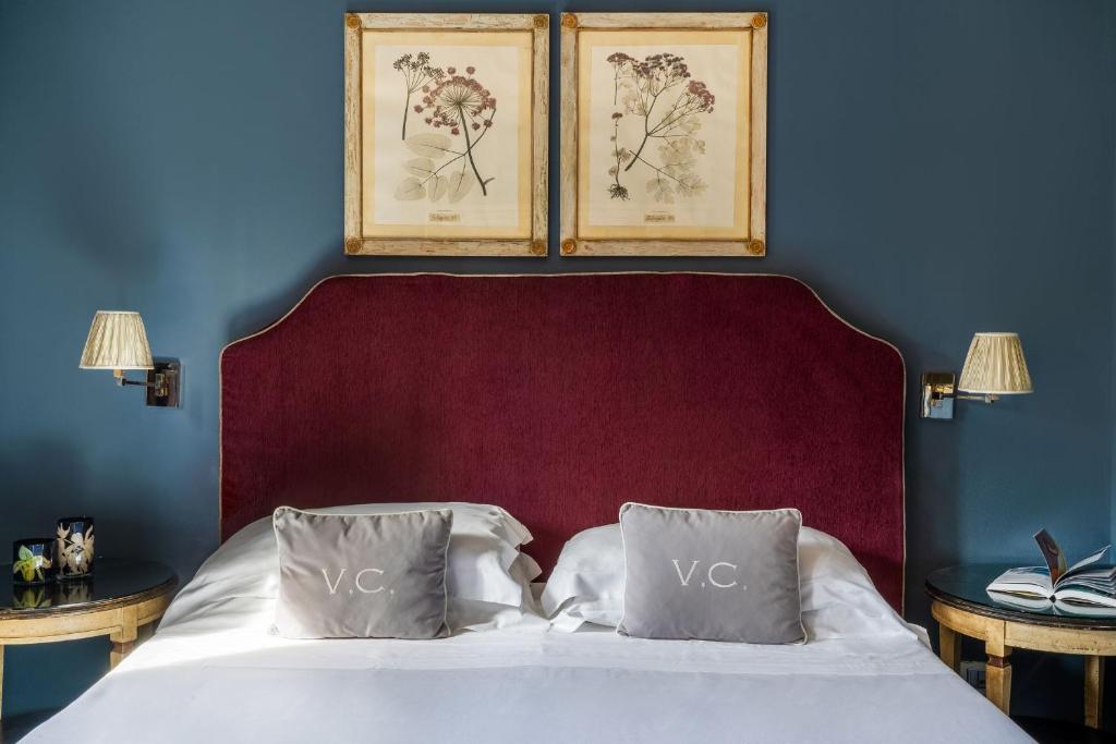 Postel nebo postele na pokoji v ubytování Hotel Villa Carlotta