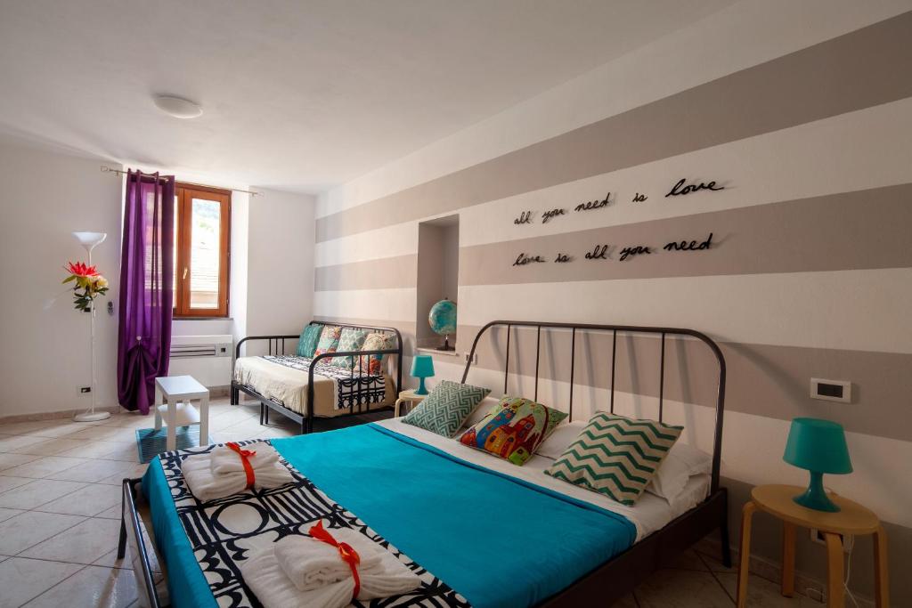 Postel nebo postele na pokoji v ubytování Ciao Bella COLORS