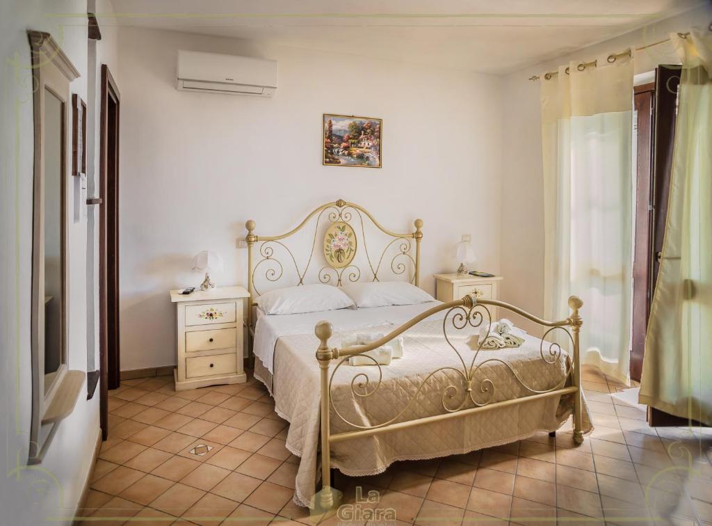 Postel nebo postele na pokoji v ubytování B&b La Giara
