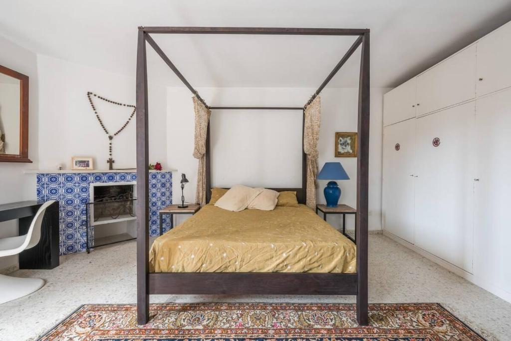 Postel nebo postele na pokoji v ubytování Villa Mimosa