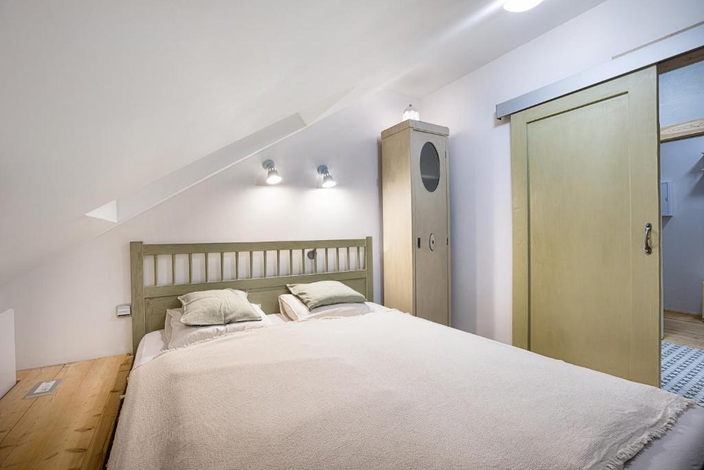 Postel nebo postele na pokoji v ubytování Apartmány v domečku
