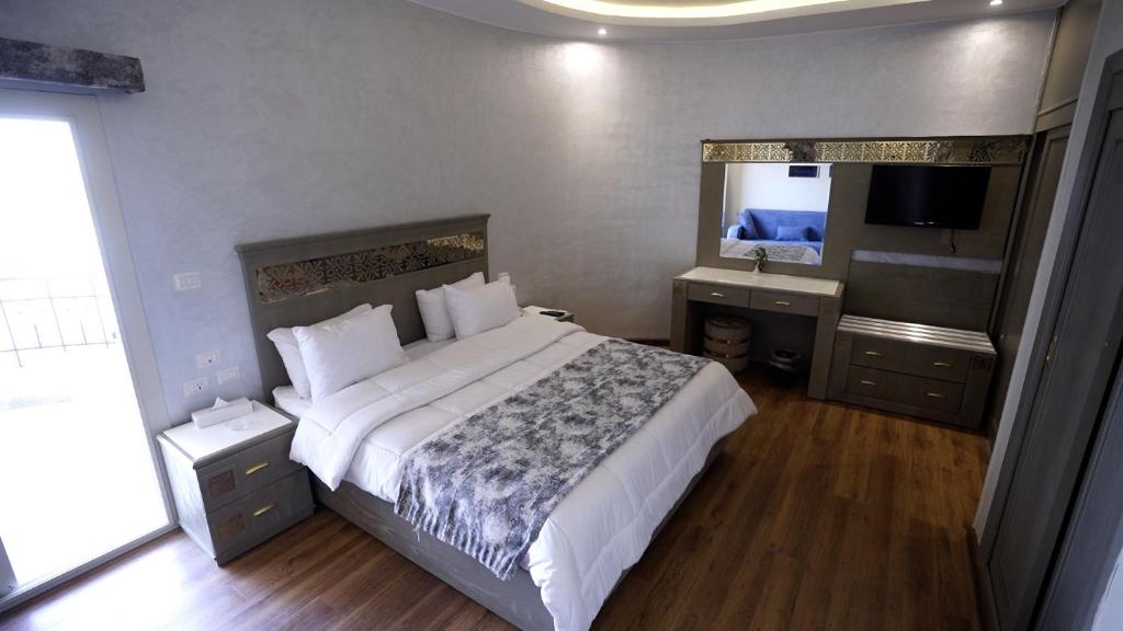 A bed or beds in a room at Lotus Luxor Hotel
