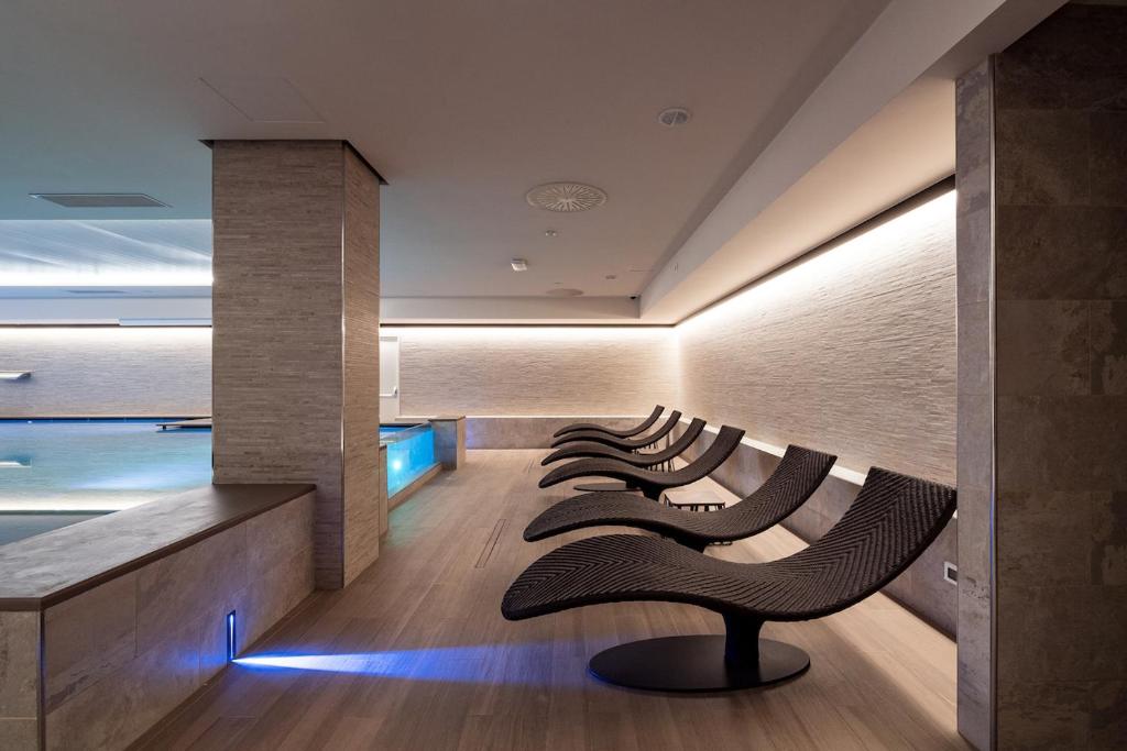 Posezení v ubytování Smy Carlos V Wellness & Spa Alghero