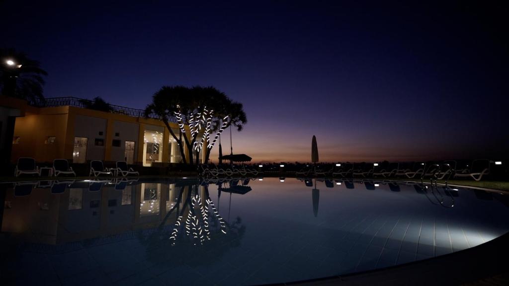 The swimming pool at or close to Lotus Luxor Hotel