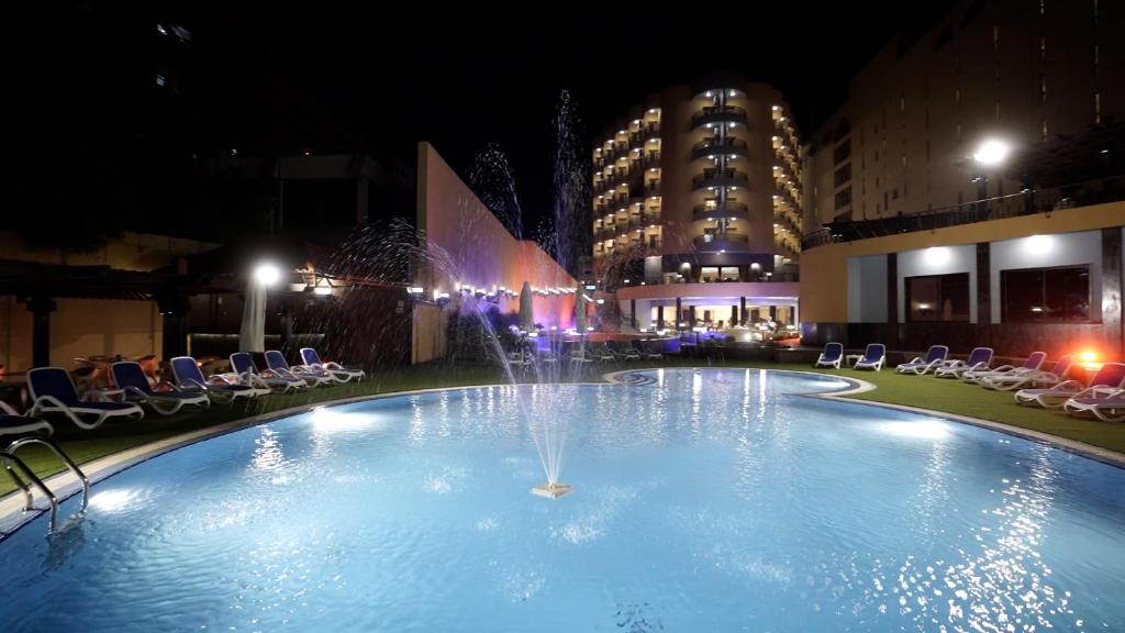 The swimming pool at or close to Lotus Luxor Hotel