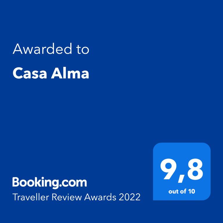 a screenshot of a cell phone with the text awarded to casa alima travelling at Casa Alma in Marbella