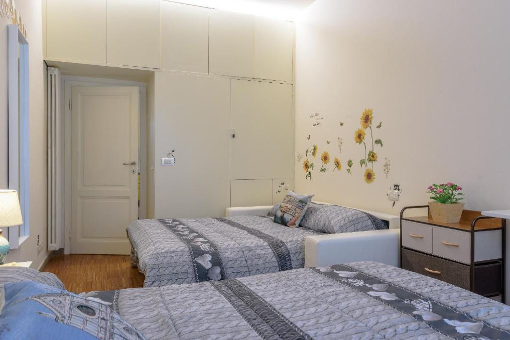 Posteľ alebo postele v izbe v ubytovaní Monnalisa Apartment tra Pitti e Ponte Vecchio
