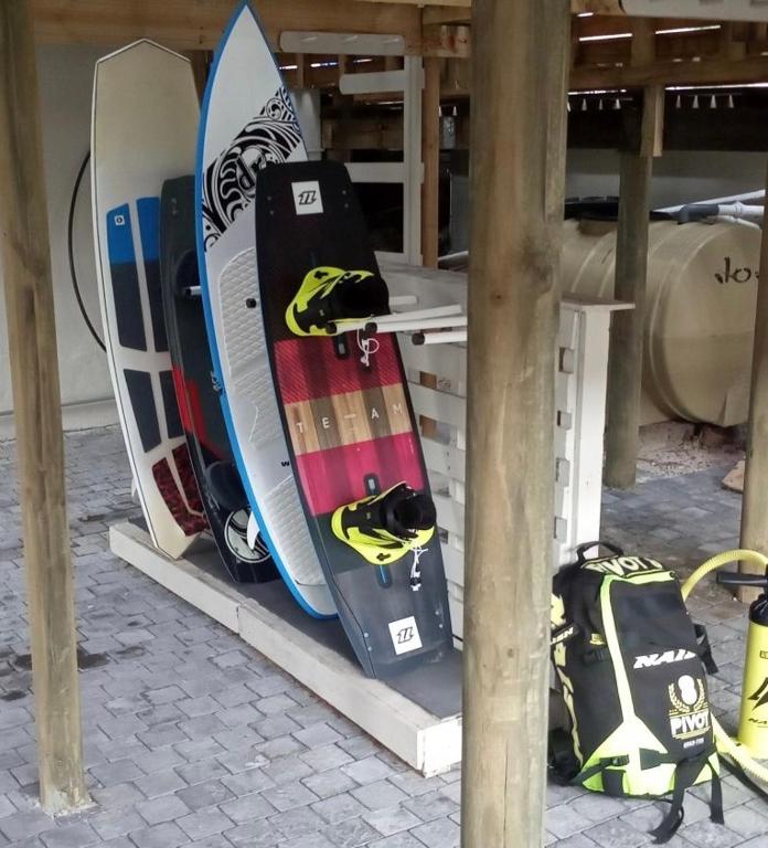 a group of snowboards sitting on a rack at Bentley's Guesthouse in Bloubergstrand